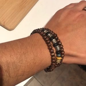 Adjustable bead bracelet and silver necklace.